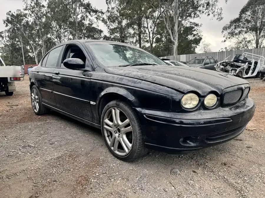 An unwanted car in the yard